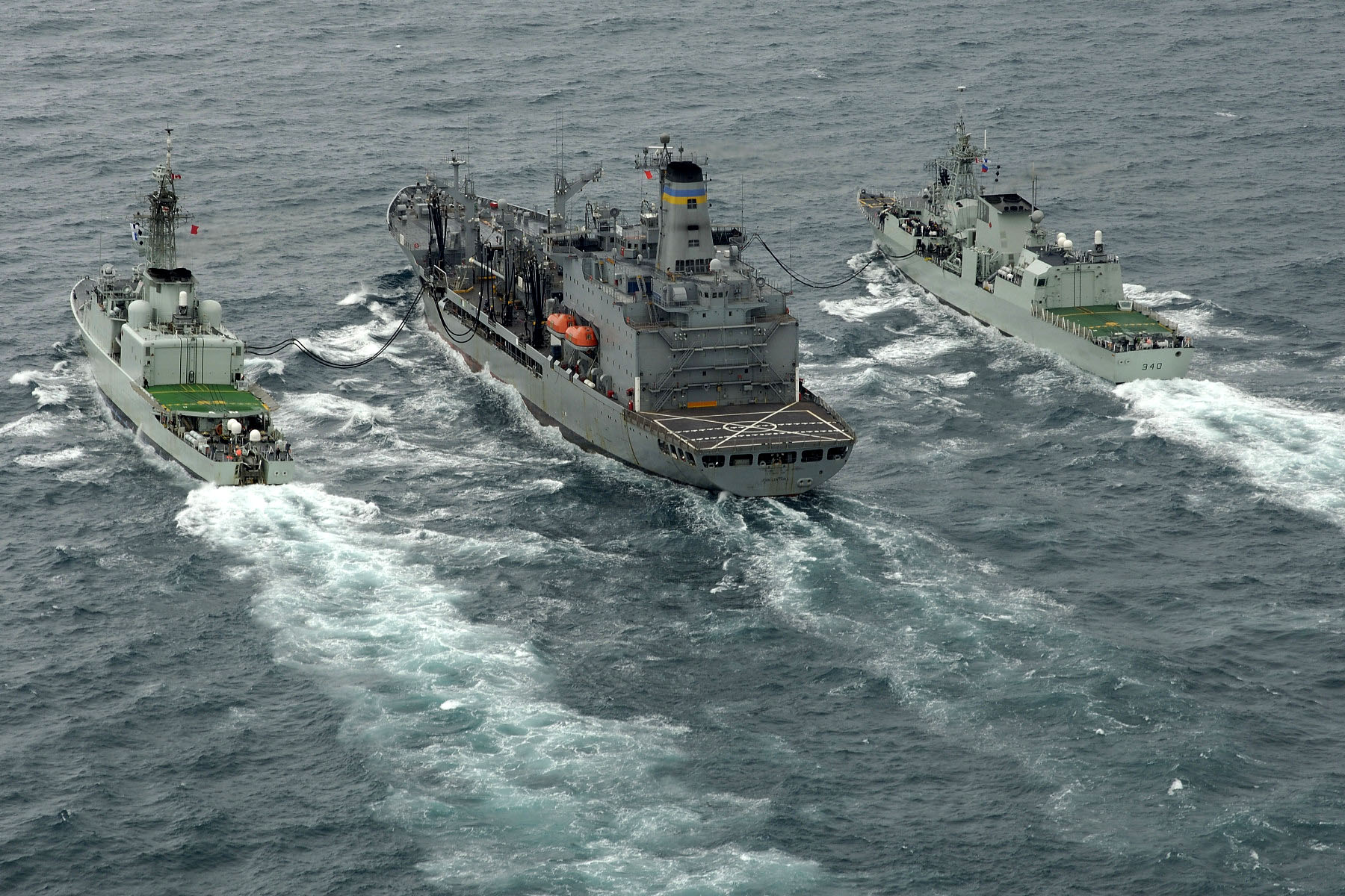 HMCS ATHABASKAN & HMCS ST. JOHN'S RASing from the USNS LEROY GRUMMAN during an exercise off the Virginia coast.