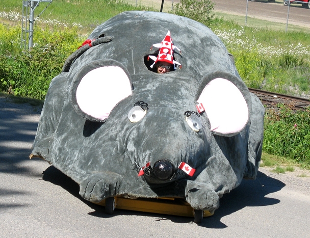 Every year our town has a few days of events known as 'Mouse Mountain Days' that occurs on Canada Day.

There's a mountain here that's shaped like a mouse, and has a small point near the 'mouth' that's shaped like a piece of cheese, hence Mouse Mountain.

Anyway, this giant mouse was entered into the parade from the Village of Fraser Lake, with yours truly as the operator.  

Spetacular shot, not really.  Fun and original, for sure. ;D