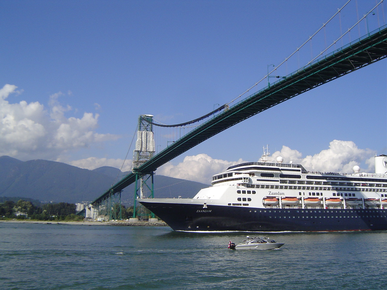 Cruise ship going under Lions Gate bridge.