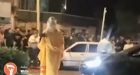 Iranian woman dragged across street as crowd cheers