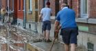 Belgians reeling after more heavy flooding rips apart streets, washes away cars