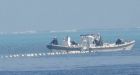 South China Sea: Philippines says Beijing installed floating barrier in contested area