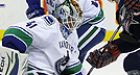 Sanford earns 1st victory with Canucks