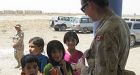 Canadian  troops dish back-to-school gear to eager kids in Kandahar