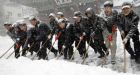 Asian cities hit by record snowfalls