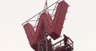 Iconic 'W' mounted atop Woodwards building