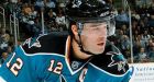 Sharks hold off Red Wings in opener