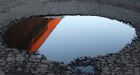 Man fears for life after getting stuck in a pothole