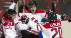 Canadian juniors double Russia in opener
