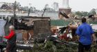 Tornadoes, storms kill 64 in southern U.S.