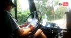 Bus driver caught doing paperwork while driving