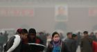 Pollution hides Beijing skyline; statues get masks