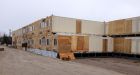 Old shipping containers find new life as buildings