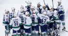 Canucks snap Chicago's 5-game winning streak in OT