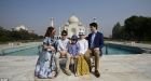 Trudeau family larks about on 'Diana bench' at Taj Mahal