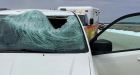 Van driver knocked unconscious after ice chunk flies off truck, through windshield on Manitoba highway