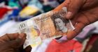 British pound plummets to near parity with U.S. dollar, before bouncing back