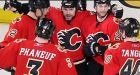 Flames rally to hand rare loss to Wild