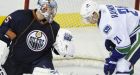 Oilers score OT win over Canucks