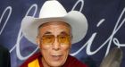 Dalai Lama given white cowboy hat before speech at Calgary conference