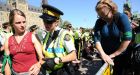 Pipeline protesters cross barricades on Parliament Hill