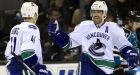 Schneider wins 4th-straight as Canucks down Sharks