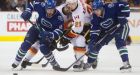 Canucks extinguish Flames with quick OT goal