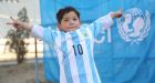 Afghan child replaces his plastic bag Lionel Messi jersey with the real thing