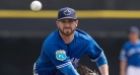 Blue Jays pitcher Hutchison hit in head by catcher's throw